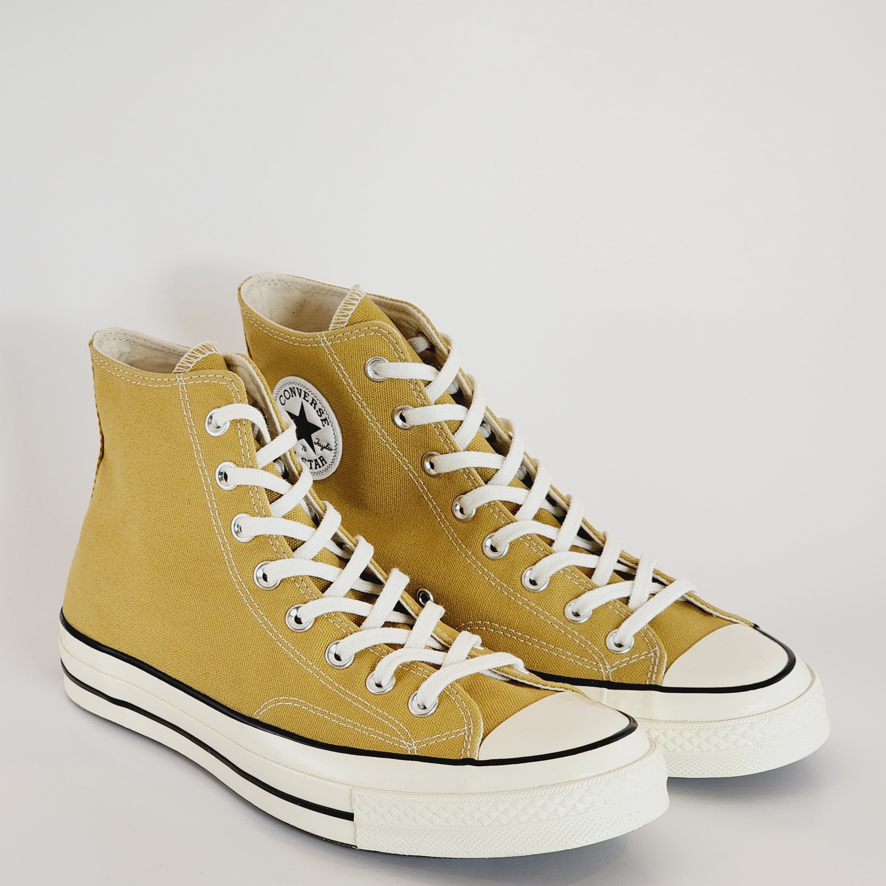 Converse yellow black egret best sale